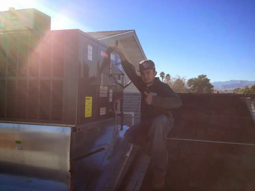HVAC technician performing HVAC Inspection on a rooftop unit in Cortlandt